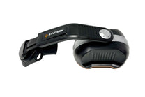 STUDSON ED-3B helmet-mounted ear defender showing side profile with 30mm blade mount arm and orange accent stripe