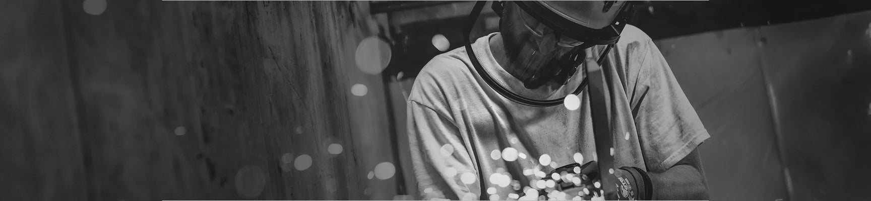 Person holding a bouquet of flowers in a blurred outdoor setting