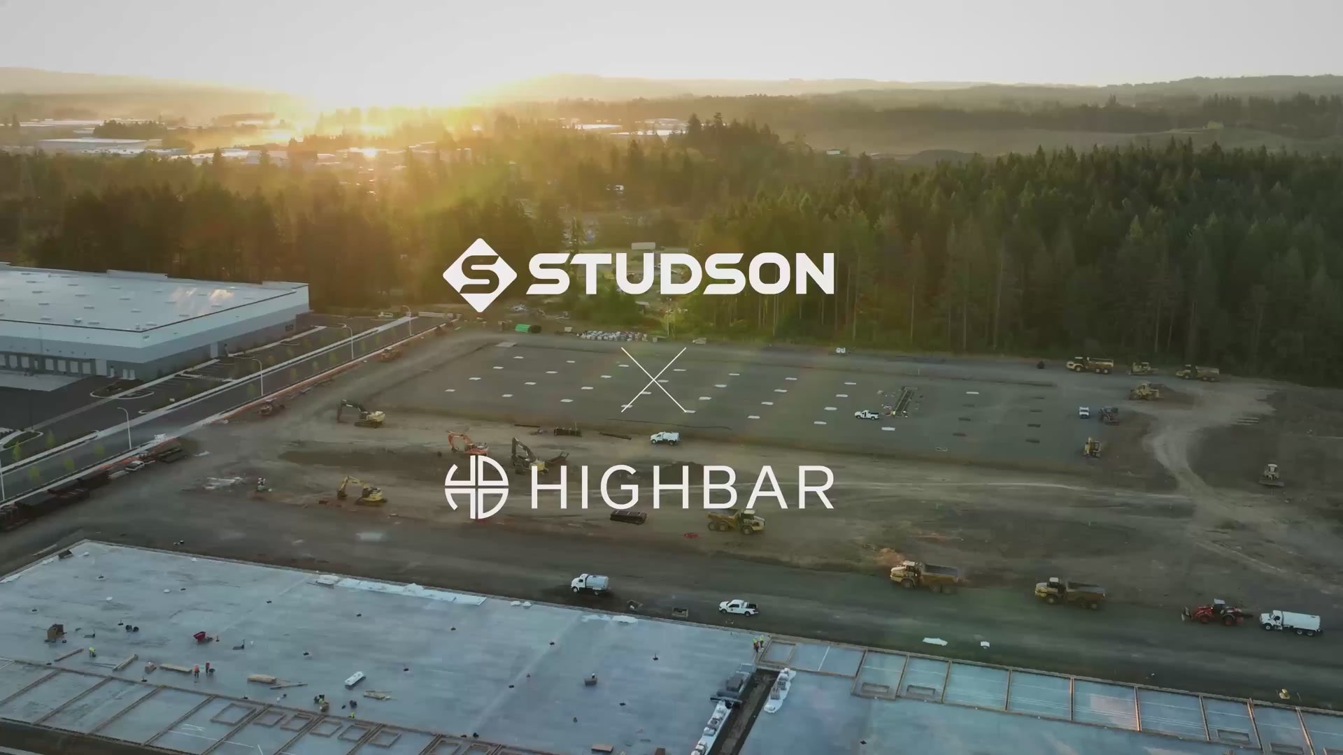 Aerial view of a parking lot with 'Studson' and 'Highbar' logos overlaid.