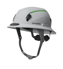 A white STUDSON SHK-1 safety helmet featuring an integrated four-point chin strap, Koroyd material that is visible through the vents, and a sleek, ventilated design for construction and roofing professionals.